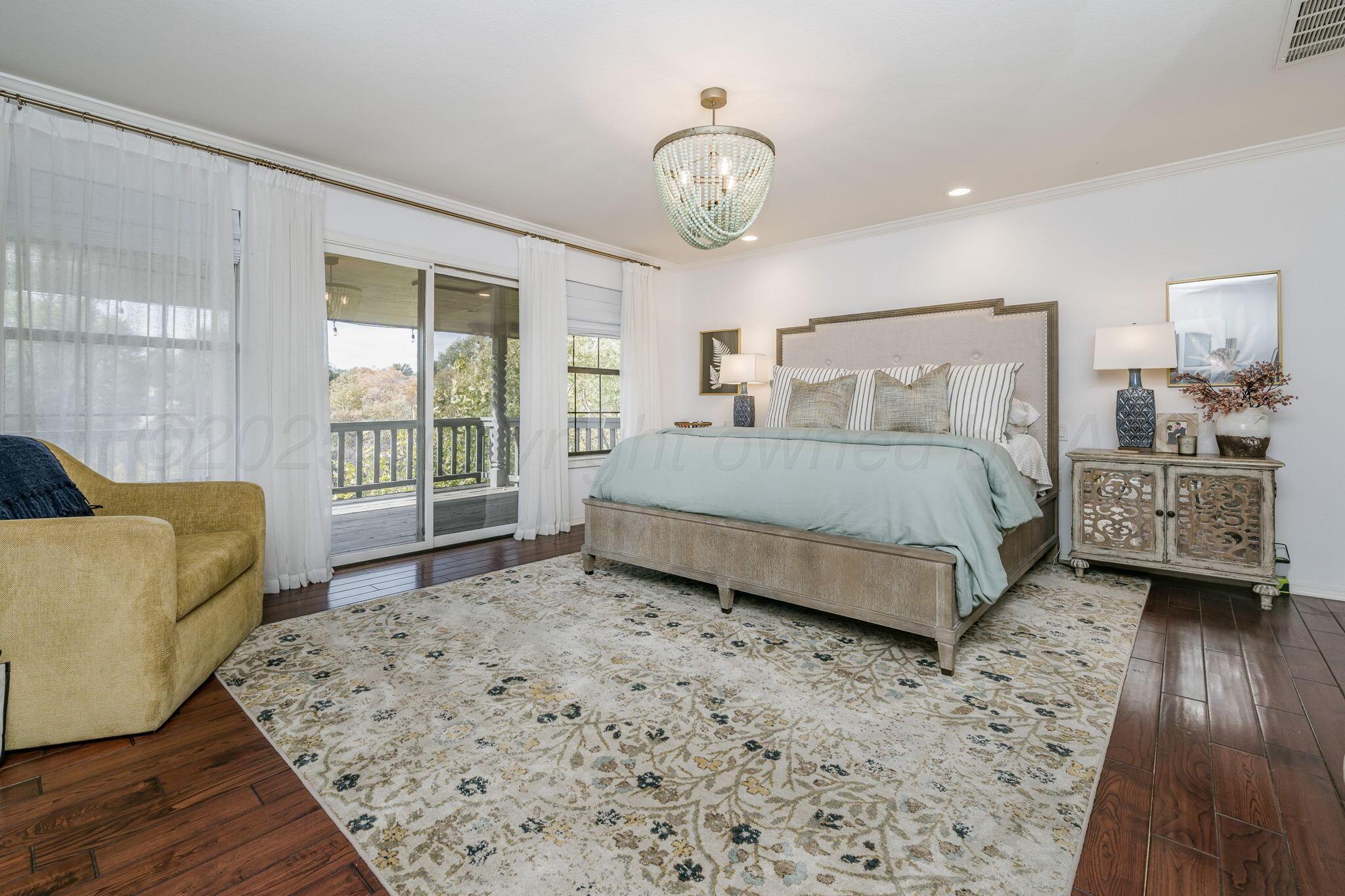 170 Dolphin Terrace Amarillo, TX 79118 - Photo 24 of 56 a bedroom with a bed a couch and dresser