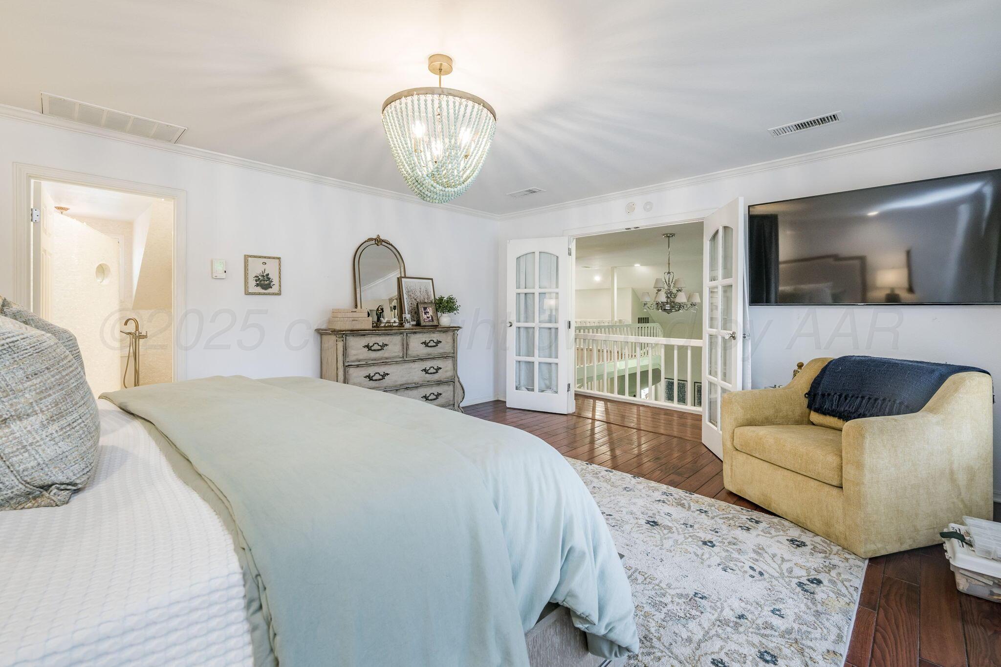 170 Dolphin Terrace Amarillo, TX 79118 - Photo 25 of 56 a spacious bedroom with a bed and a flat screen television