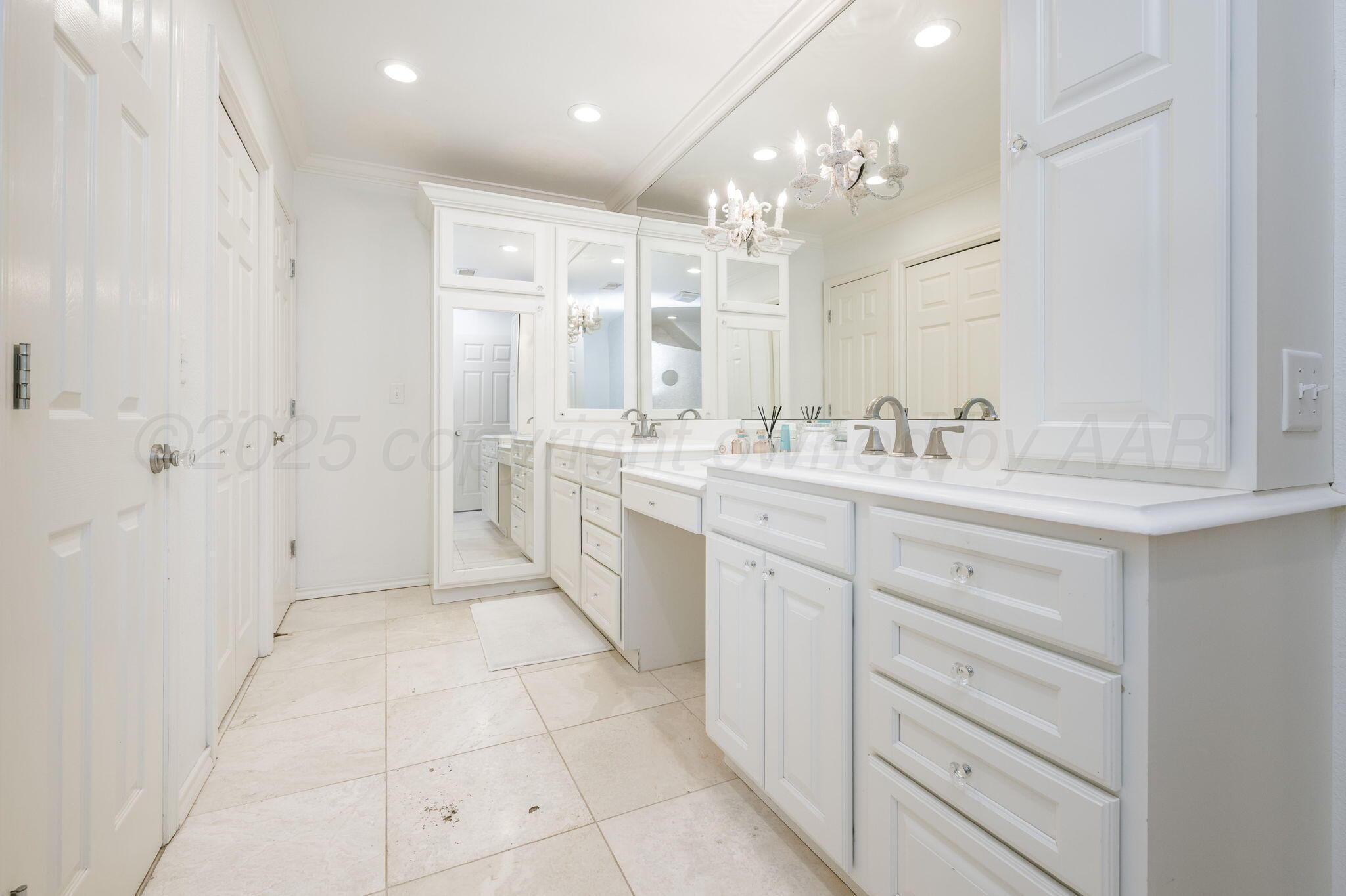 170 Dolphin Terrace Amarillo, TX 79118 - Photo 26 of 56 a spacious bathroom with a mirror sink and a shower