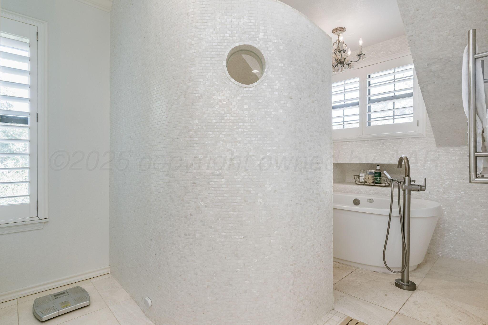 170 Dolphin Terrace Amarillo, TX 79118 - Photo 27 of 56 a kitchen with a refrigerator and white cabinets