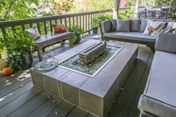 a view of a patio with couches and potted plant