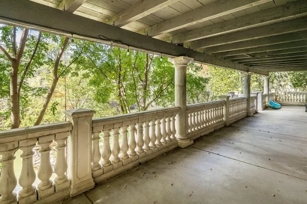 a backyard of a house with table and chairs