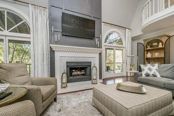 a living room with furniture and a fireplace
