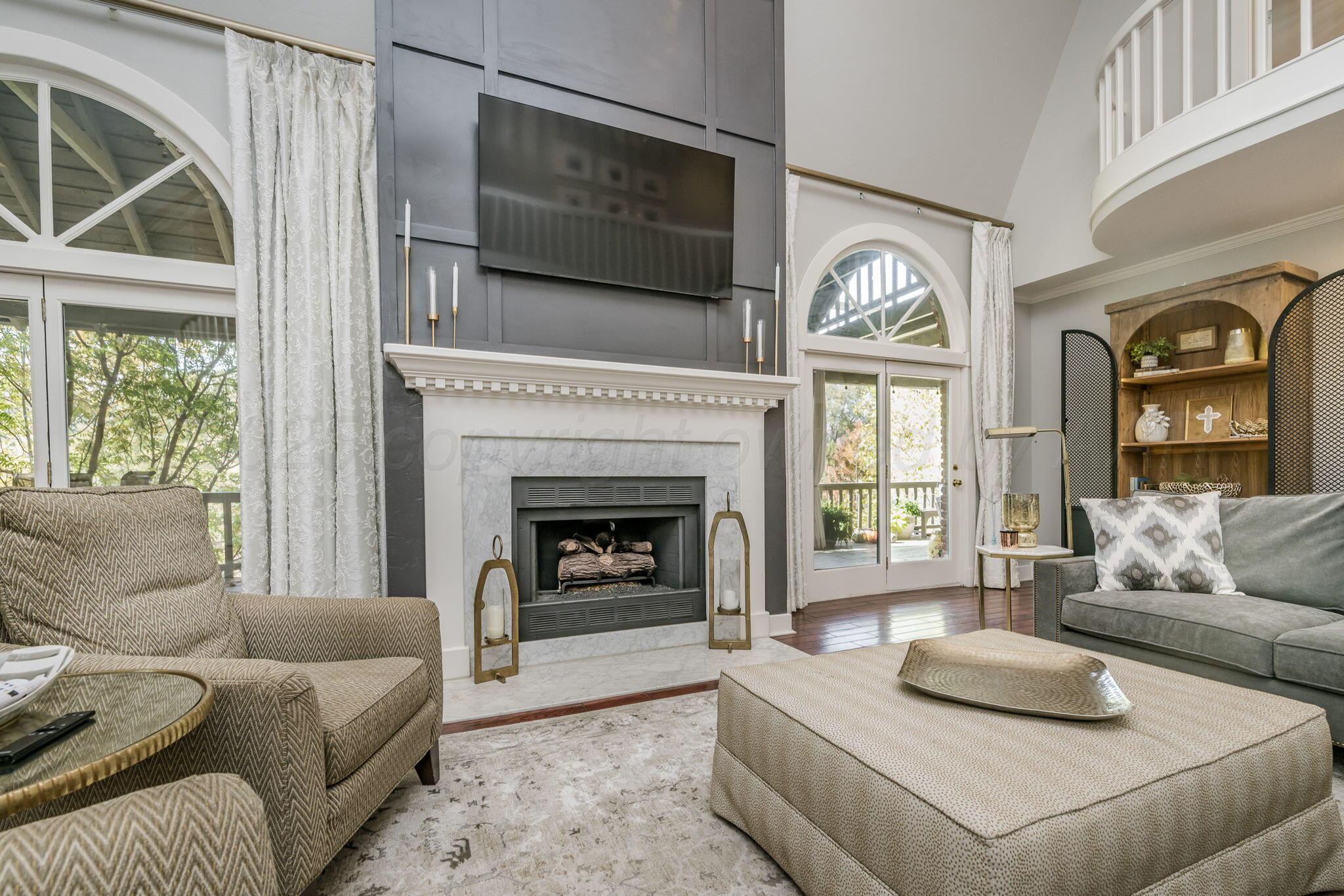 170 Dolphin Terrace Amarillo, TX 79118 - Photo 7 of 56 a living room with furniture and a fireplace