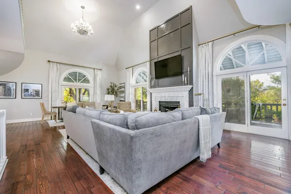 a living room with furniture fireplace and a flat screen tv