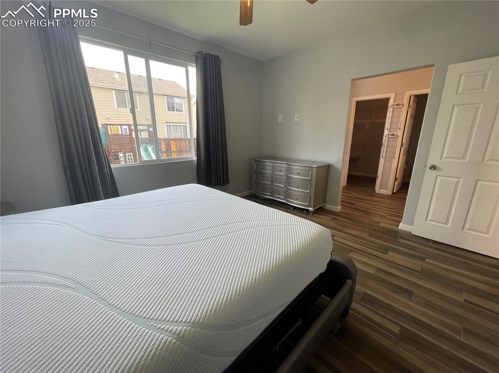 7631 Coffee Road Peyton, CO 80831 - Photo 17 of 28 a bed sitting in a bedroom next to a window