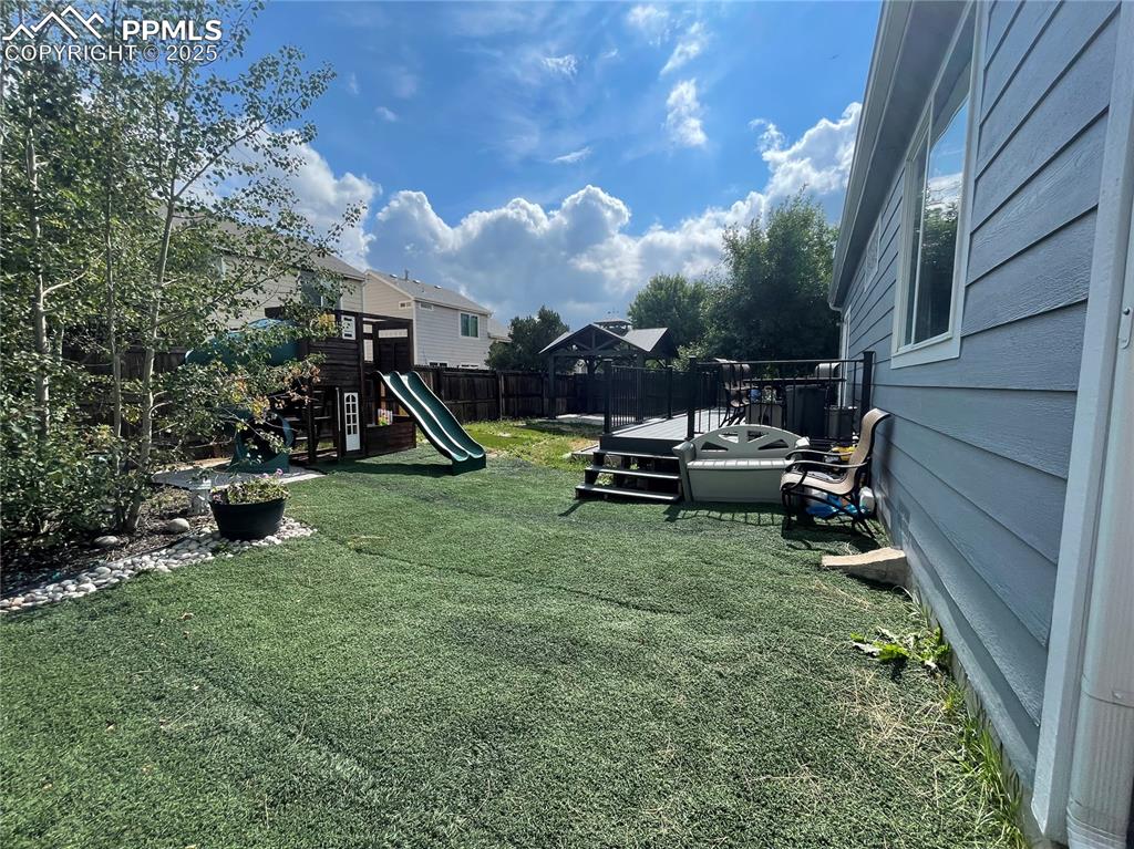 7631 Coffee Road Peyton, CO 80831 - Photo 25 of 28 a view of a park with slide