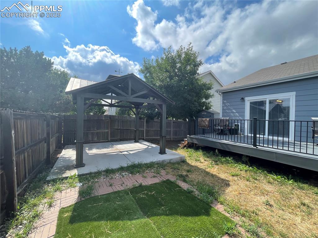 7631 Coffee Road Peyton, CO 80831 - Photo 26 of 28 a view of a house with swimming pool and a yard