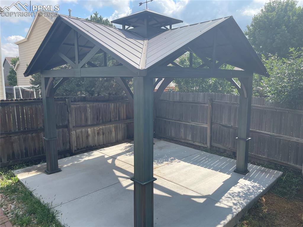7631 Coffee Road Peyton, CO 80831 - Photo 28 of 28 a backyard of a house with table and chairs