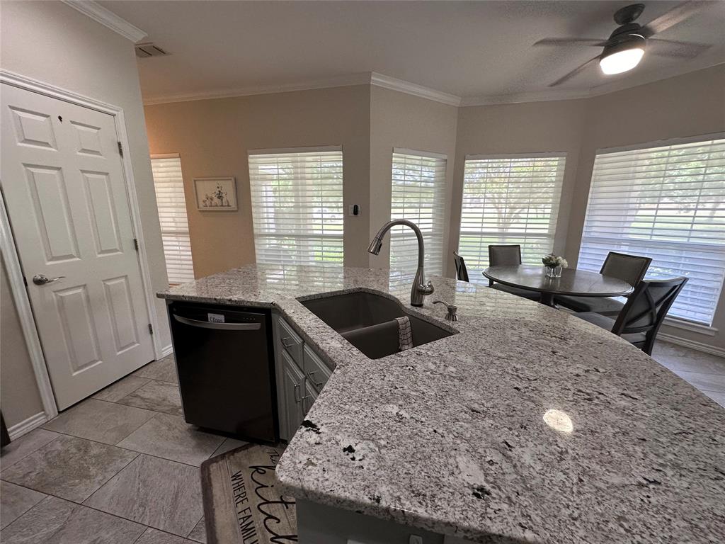 1425 Pecan Hill Road Stephenville, TX 76401 - Photo 11 of 40 a kitchen with granite countertop a stove a sink and a granite counter tops