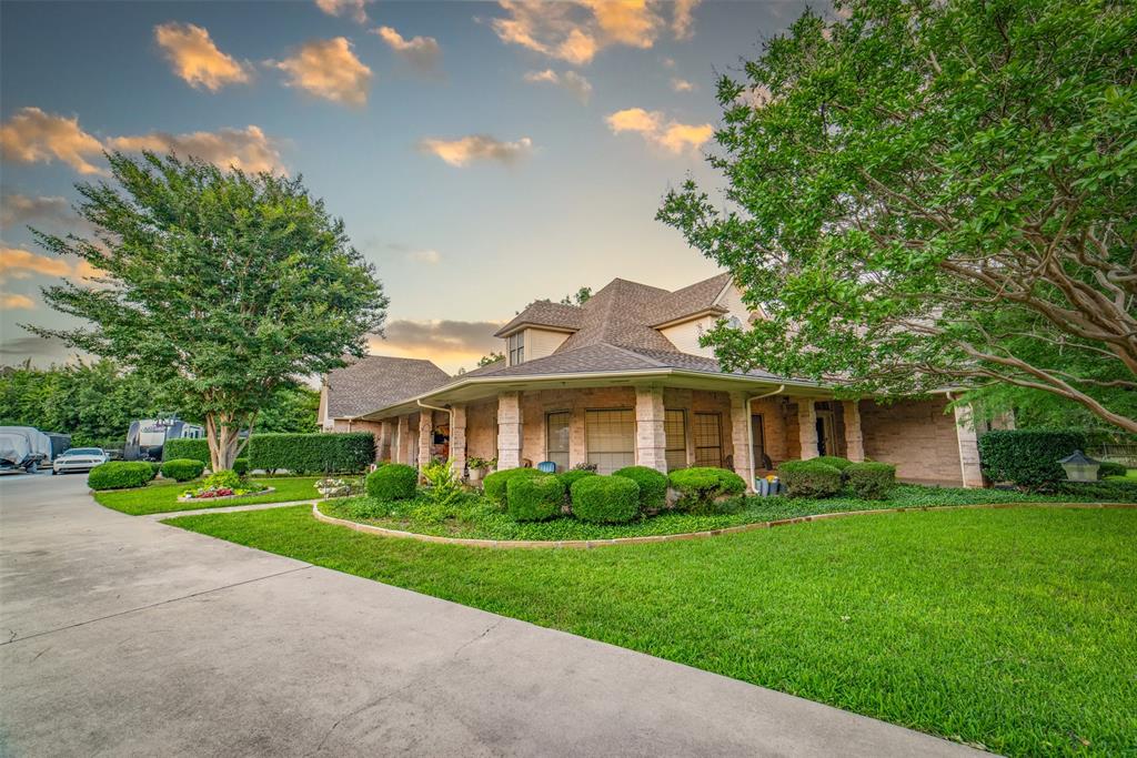 1425 Pecan Hill Road Stephenville, TX 76401 - Photo 17 of 40 a front view of house with yard and green space