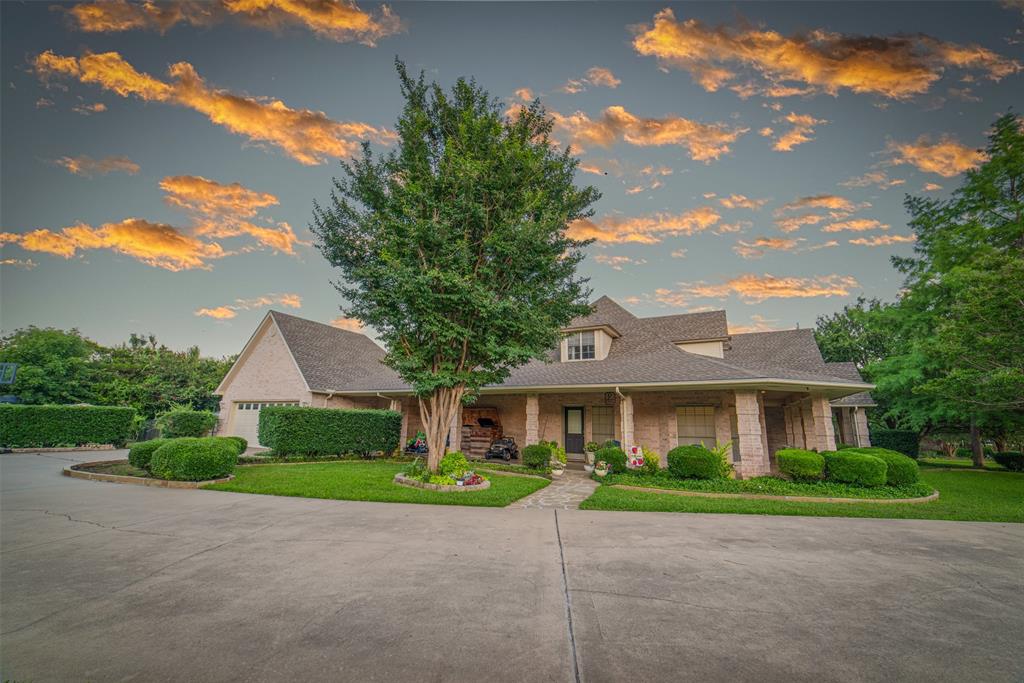 1425 Pecan Hill Road Stephenville, TX 76401 - Photo 18 of 40 a front view of a house with a yard and garage