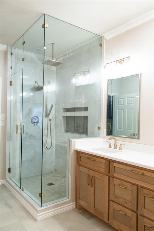 1425 Pecan Hill Road Stephenville, TX 76401 - Photo 19 of 40 a bathroom with a shower sink and mirror