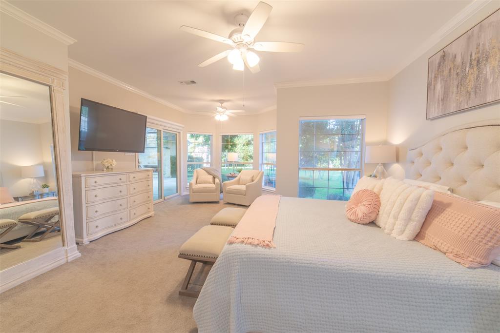 1425 Pecan Hill Road Stephenville, TX 76401 - Photo 2 of 40 a bedroom with a large bed and a flat screen tv