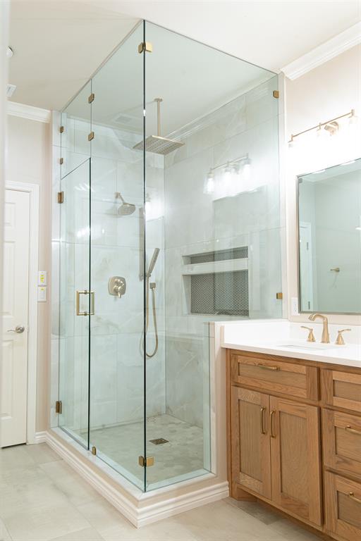 1425 Pecan Hill Road Stephenville, TX 76401 - Photo 23 of 40 a bathroom with a shower sink and mirror
