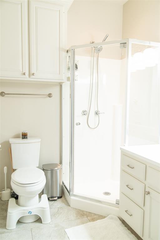 1425 Pecan Hill Road Stephenville, TX 76401 - Photo 29 of 40 a bathroom with a toilet and a shower
