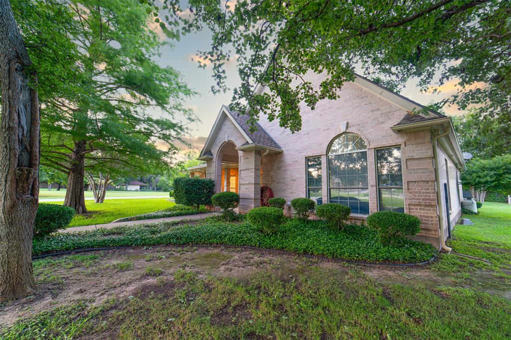 1425 Pecan Hill Road Stephenville, TX 76401 - Photo 30 of 40 a front view of a house with garden
