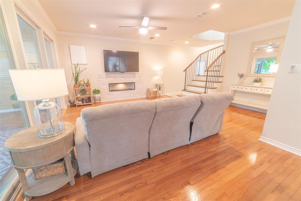 1425 Pecan Hill Road Stephenville, TX 76401 - Photo 7 of 40 a living room with furniture and a wooden floor