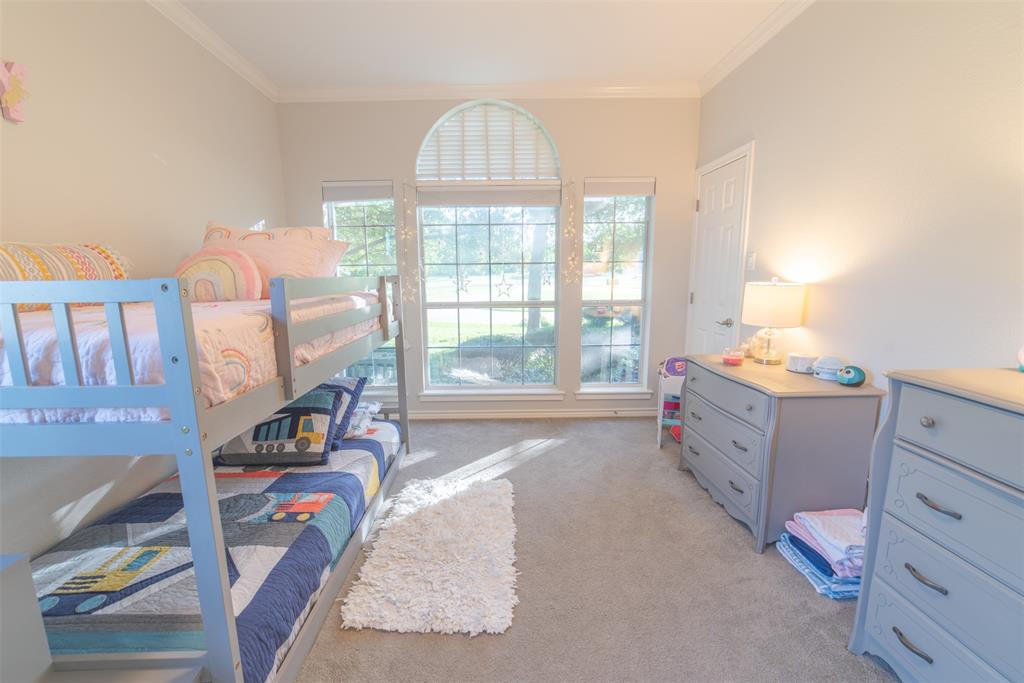 1425 Pecan Hill Road Stephenville, TX 76401 - Photo 8 of 40 a bed room with a bed and a window