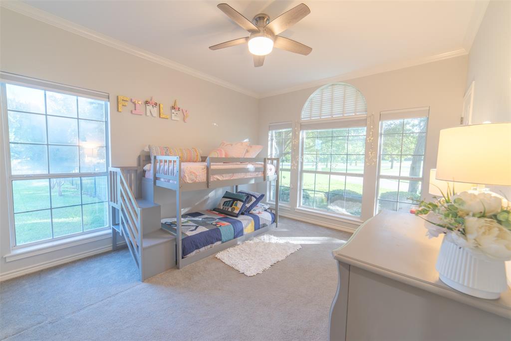 1425 Pecan Hill Road Stephenville, TX 76401 - Photo 9 of 40 a living room with furniture and a chandelier