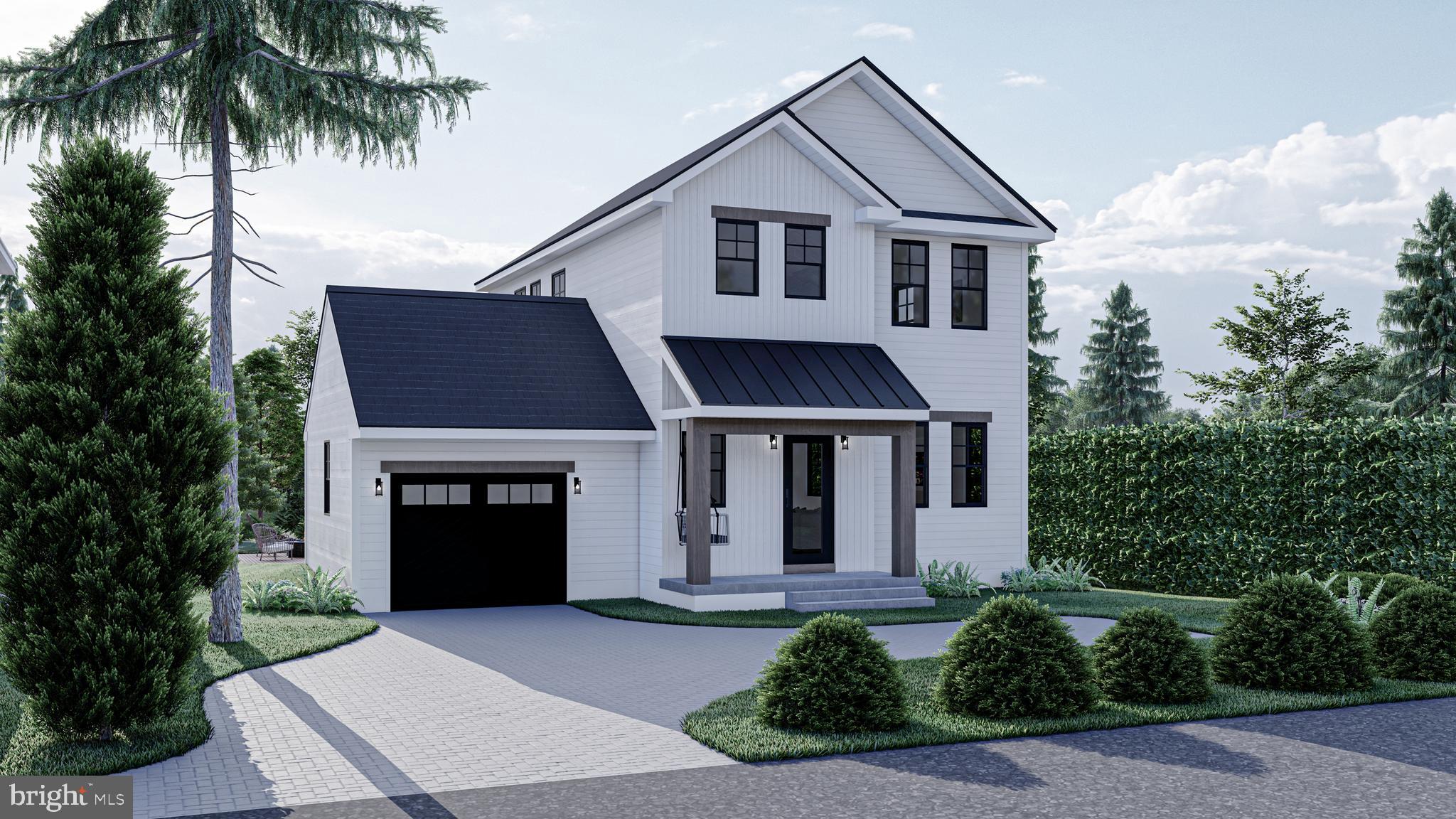 Lot#2 Willow Road Wallingford, PA 19086 - Photo 1 of 13 a front view of a house with a yard and garage