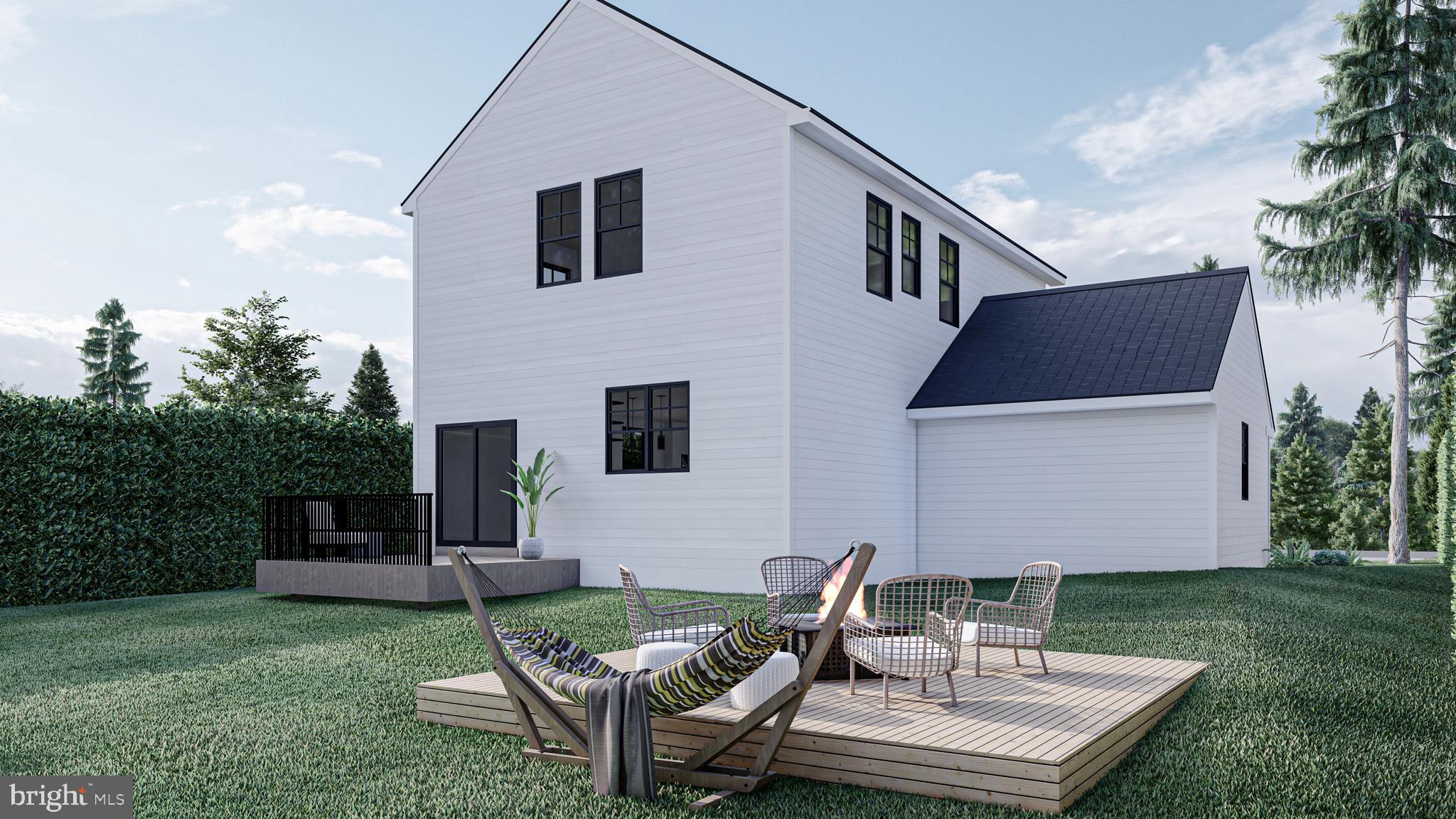 Lot#2 Willow Road Wallingford, PA 19086 - Photo 12 of 13 a backyard of a house with table and chairs