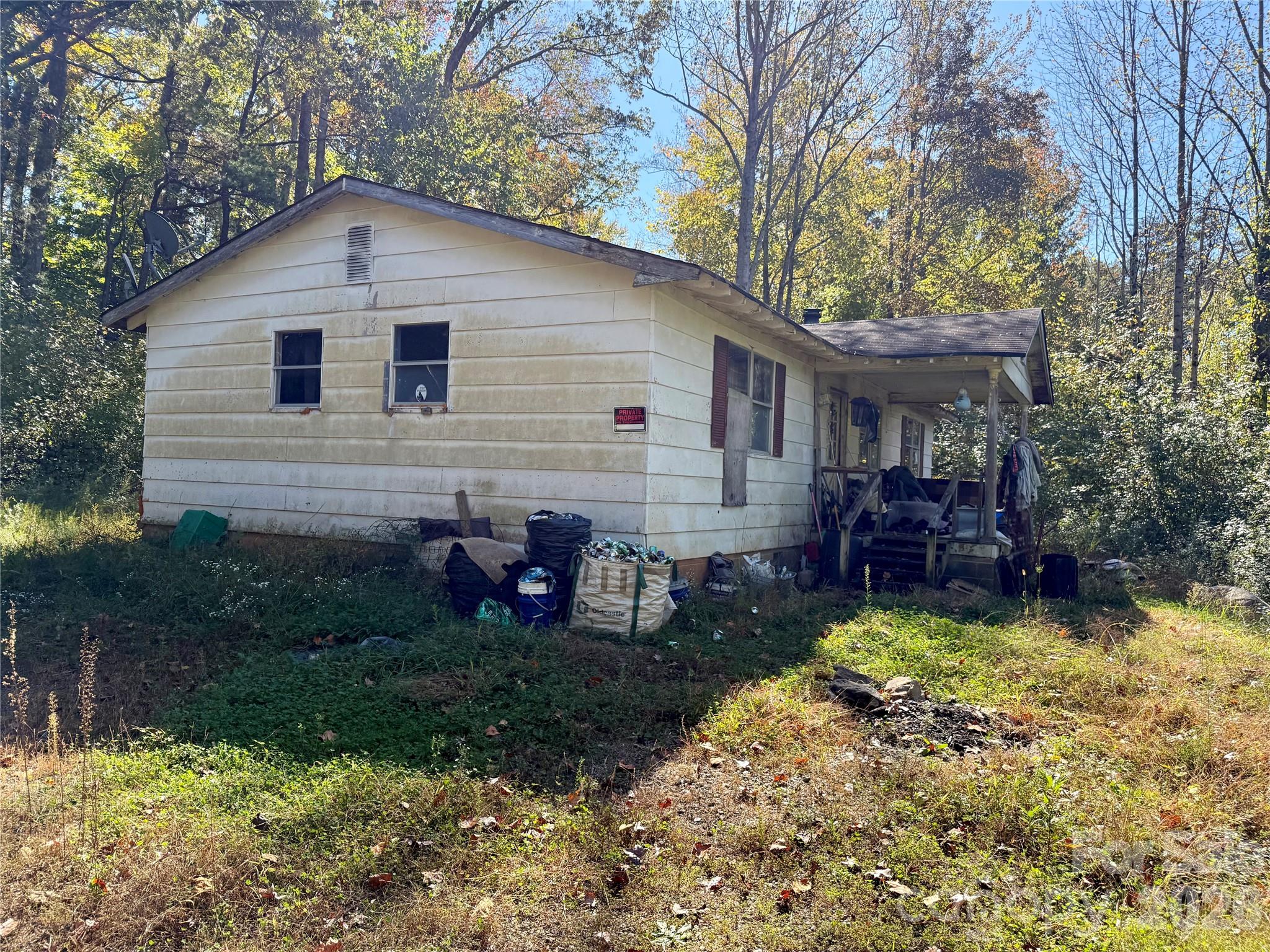 229 Kelsey Lane Rutherfordton, NC 28139 - Photo 1 of 25 a view of a house with a yard chairs and a table