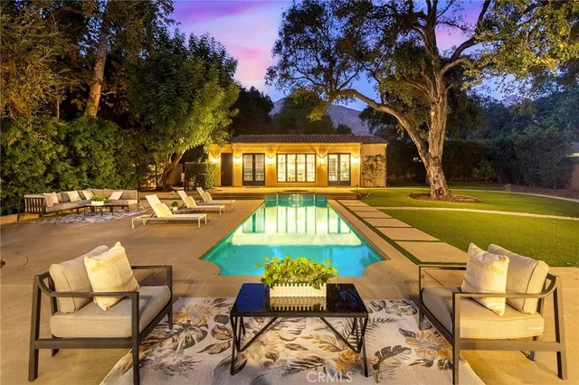 a view of swimming pool with outdoor seating