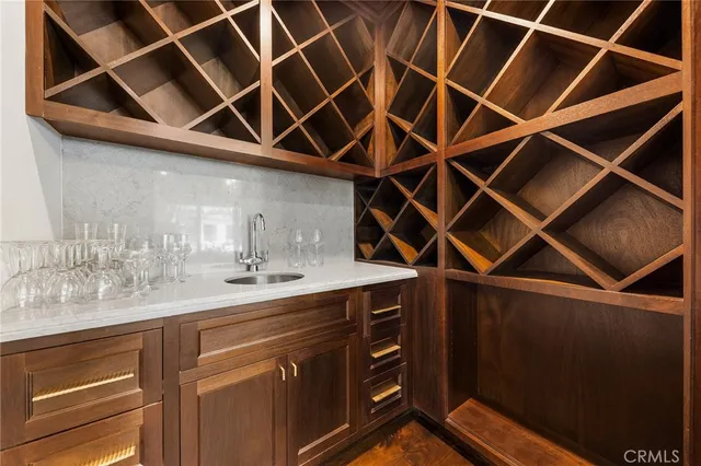 a living room with furniture or chandelier and a wooden floor