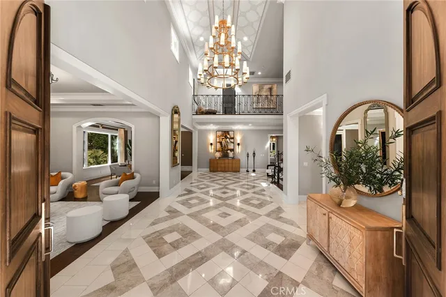 a view of a hallway with a white furniture and a large window