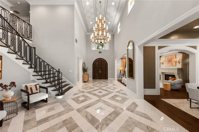 a view of a dining room with furniture large windows and wooden floor