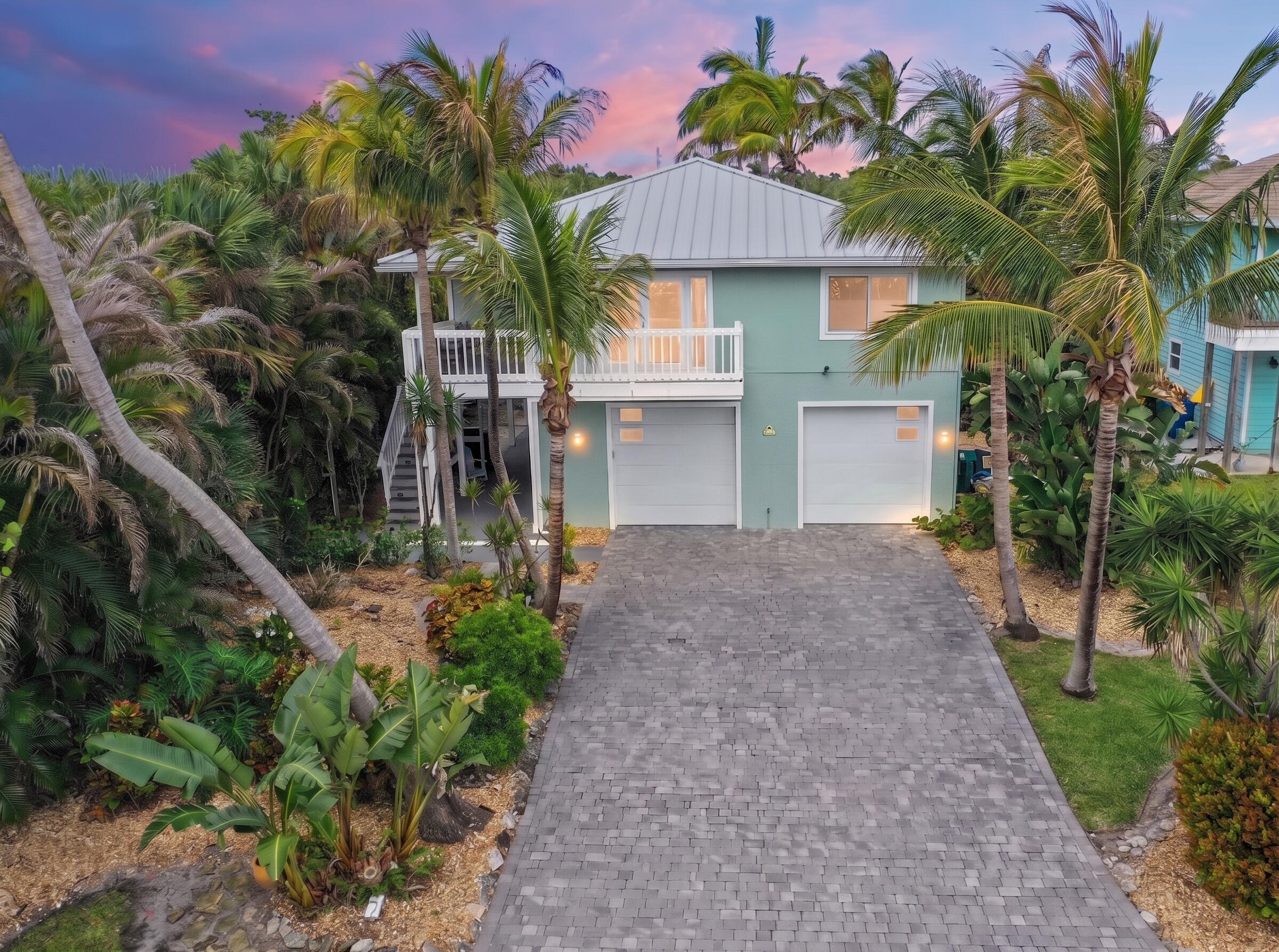 413 Hernando Street Fort Pierce, FL 34949 - Photo 1 of 43 a front view of a house with a yard