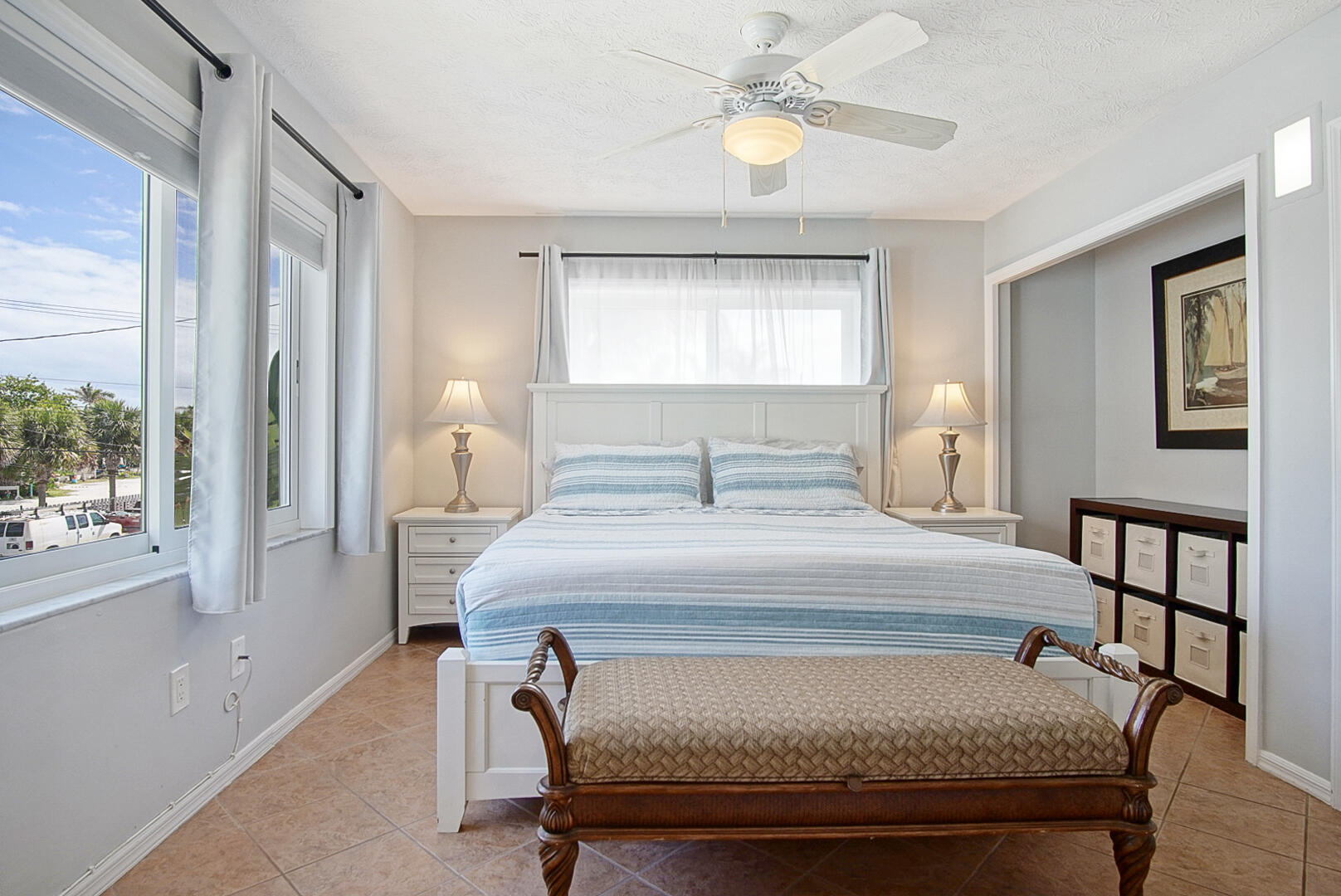 413 Hernando Street Fort Pierce, FL 34949 - Photo 16 of 43 a bedroom with a bed and a window
