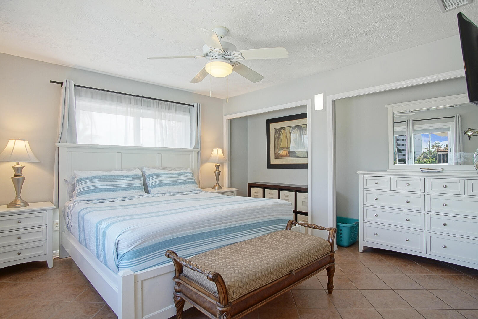 413 Hernando Street Fort Pierce, FL 34949 - Photo 17 of 43 a bedroom with a bed and a dresser
