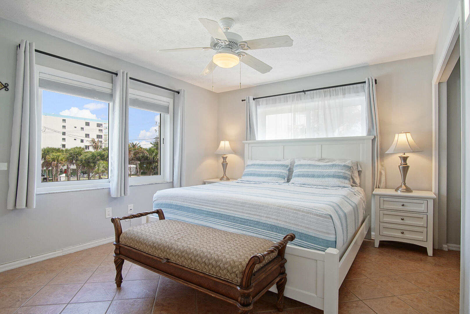 413 Hernando Street Fort Pierce, FL 34949 - Photo 18 of 43 a bedroom with a bed and a large window