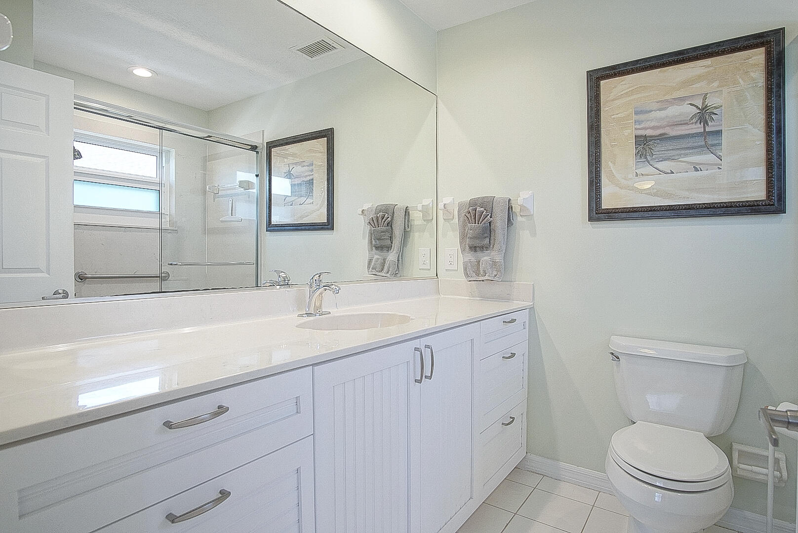 413 Hernando Street Fort Pierce, FL 34949 - Photo 20 of 43 a bathroom with a toilet a sink and mirror