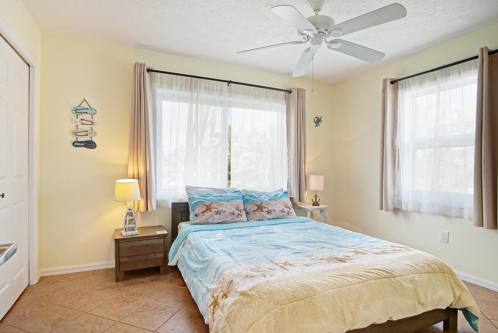 413 Hernando Street Fort Pierce, FL 34949 - Photo 22 of 43 a bedroom with a bed and a window