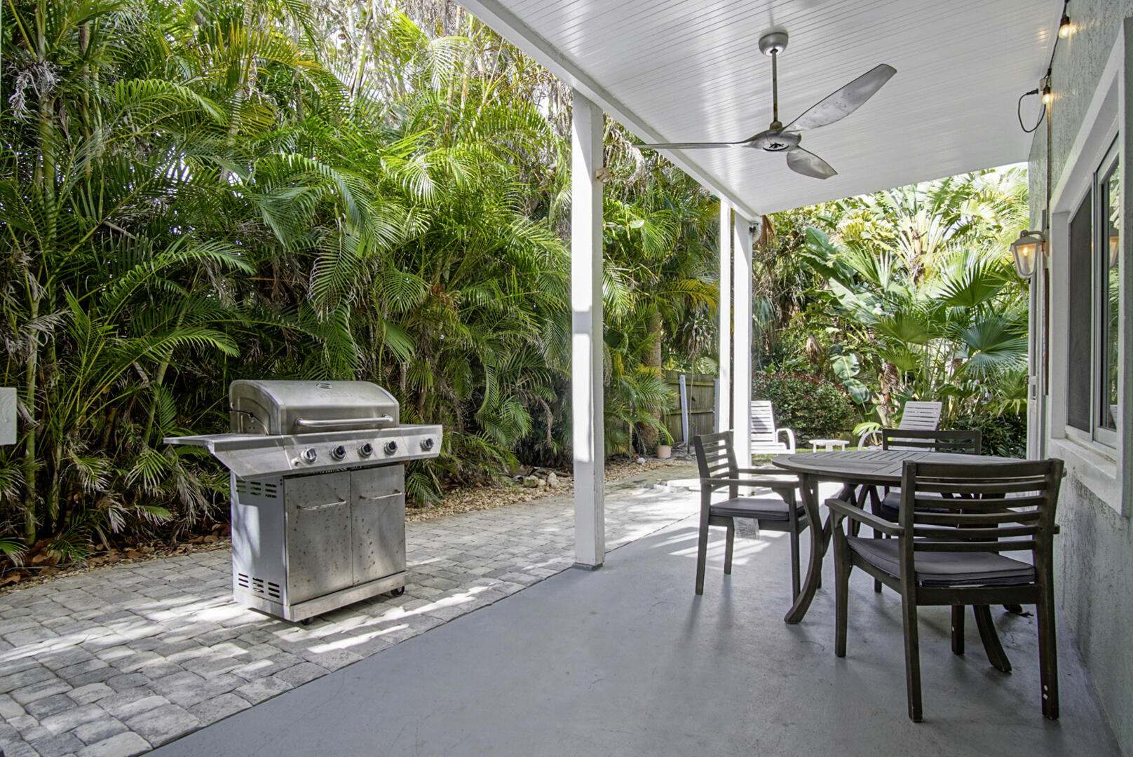 413 Hernando Street Fort Pierce, FL 34949 - Photo 25 of 43 a view of a patio with a table and chairs