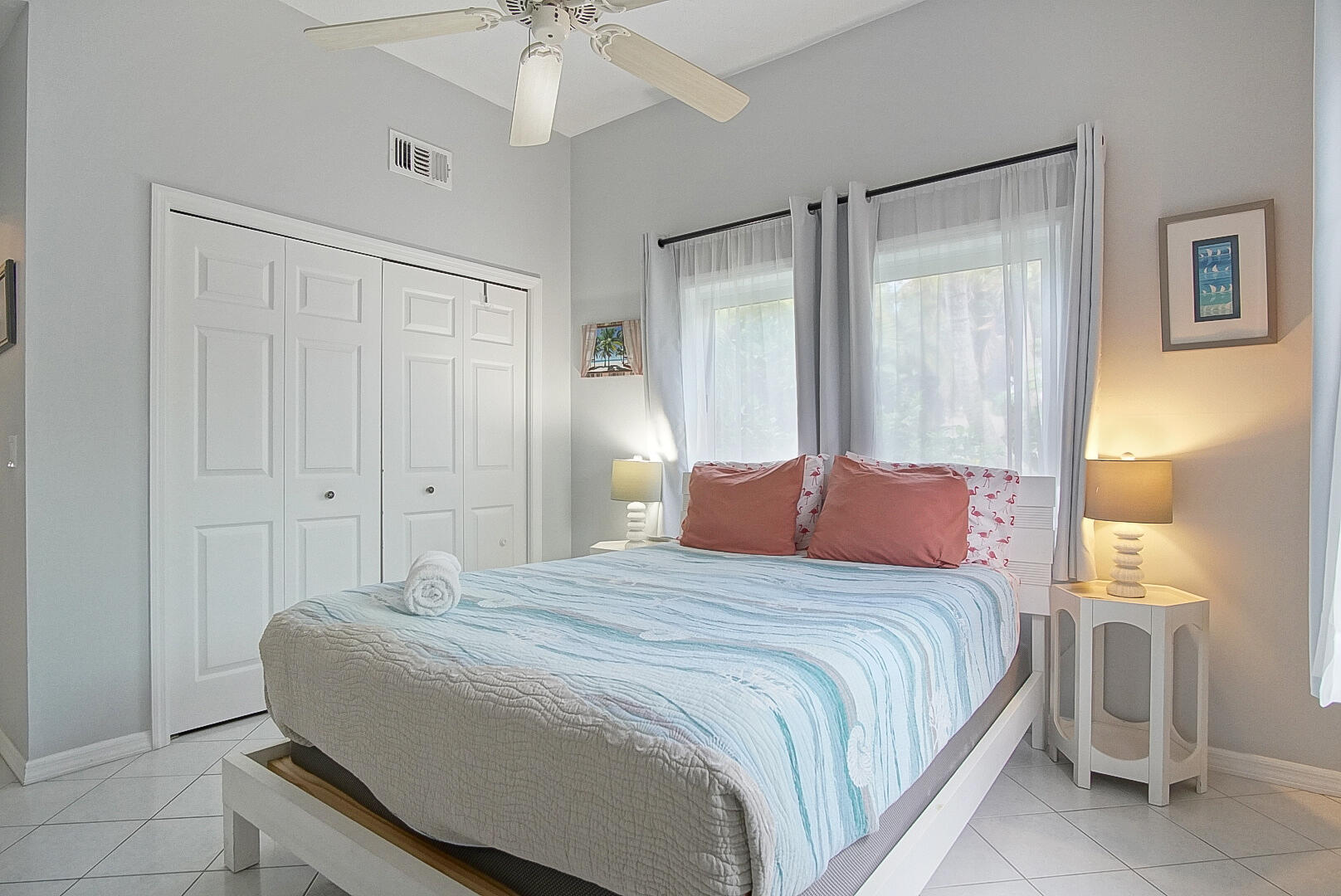 413 Hernando Street Fort Pierce, FL 34949 - Photo 30 of 43 a bedroom with a bed and a chandelier