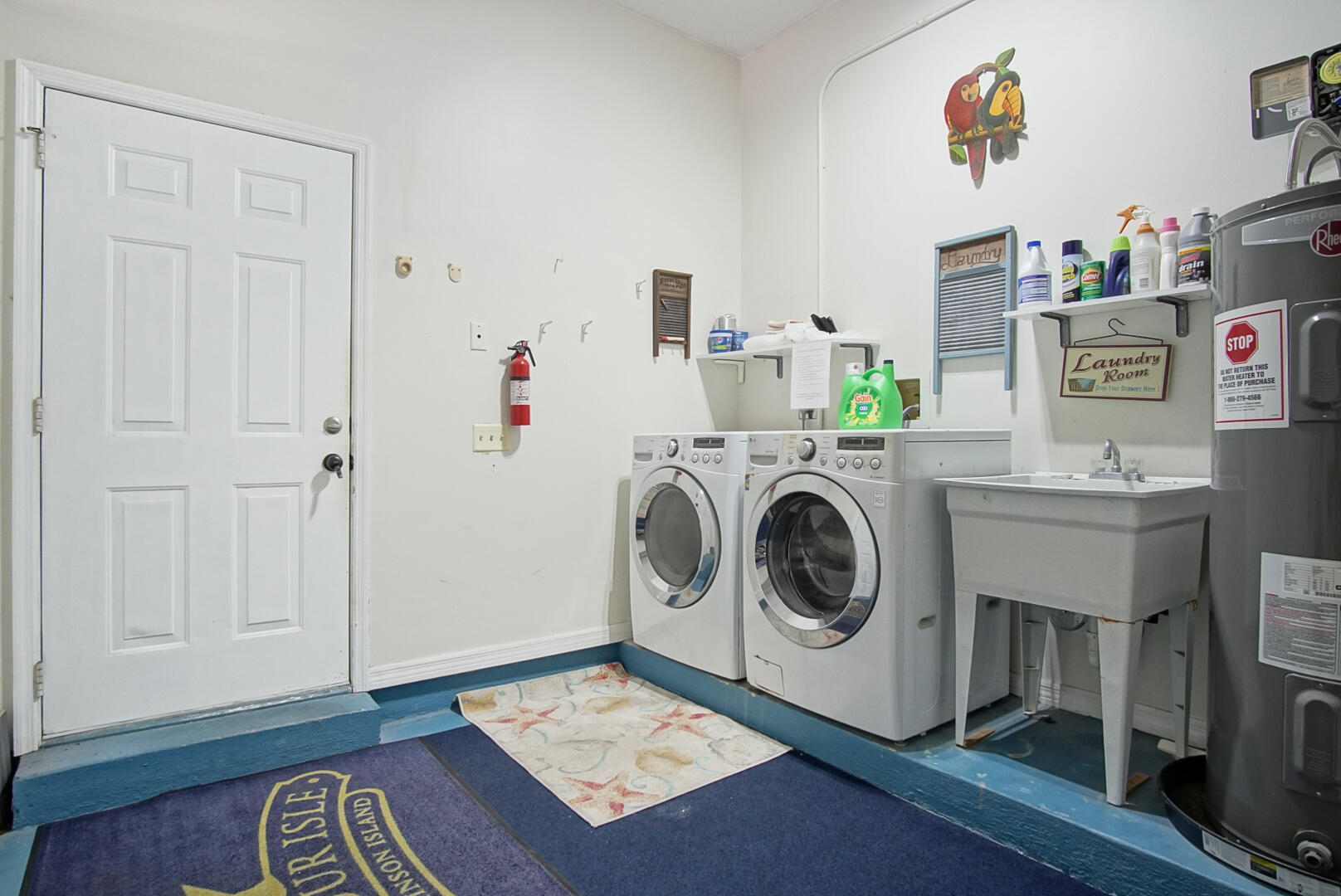 413 Hernando Street Fort Pierce, FL 34949 - Photo 33 of 43 a utility room with dryer washer and a view of living room