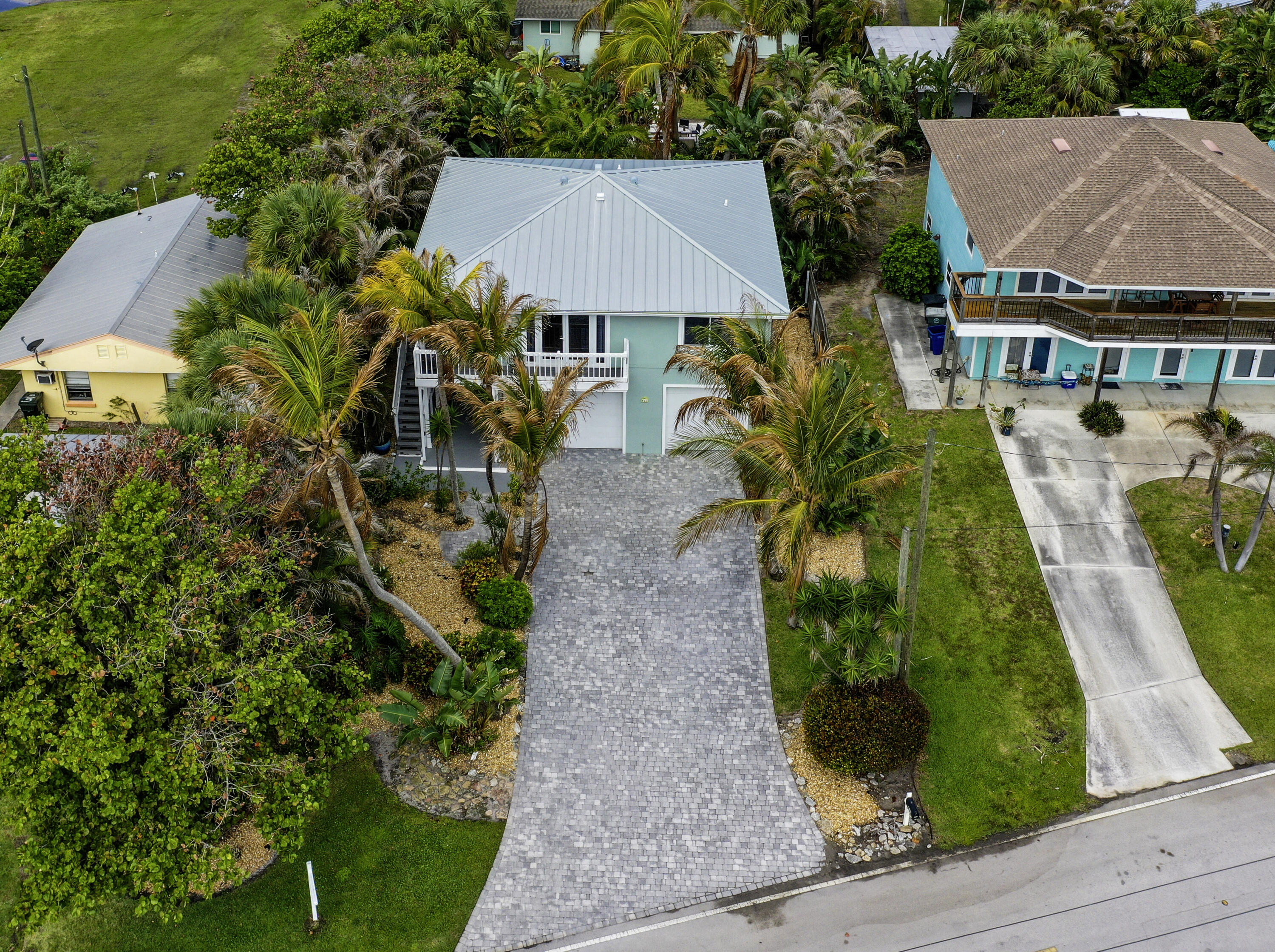 413 Hernando Street Fort Pierce, FL 34949 - Photo 38 of 43 an aerial view of multiple houses with yard