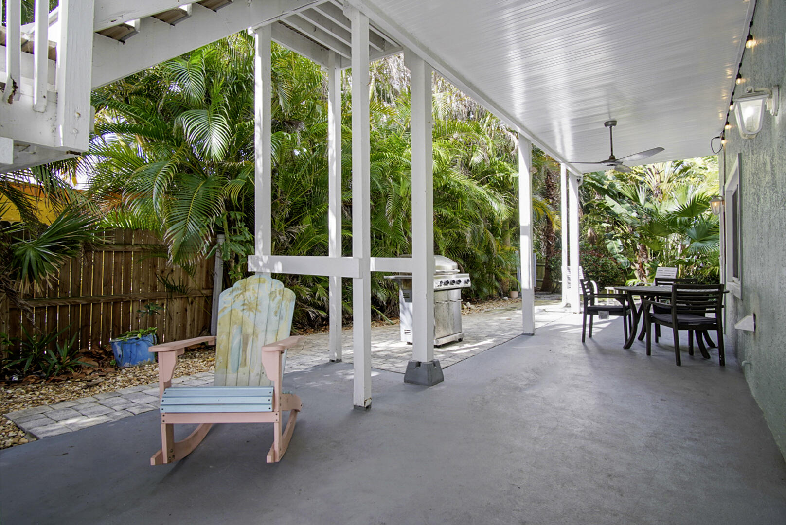 413 Hernando Street Fort Pierce, FL 34949 - Photo 5 of 43 a view of a patio with table and chairs and potted plants