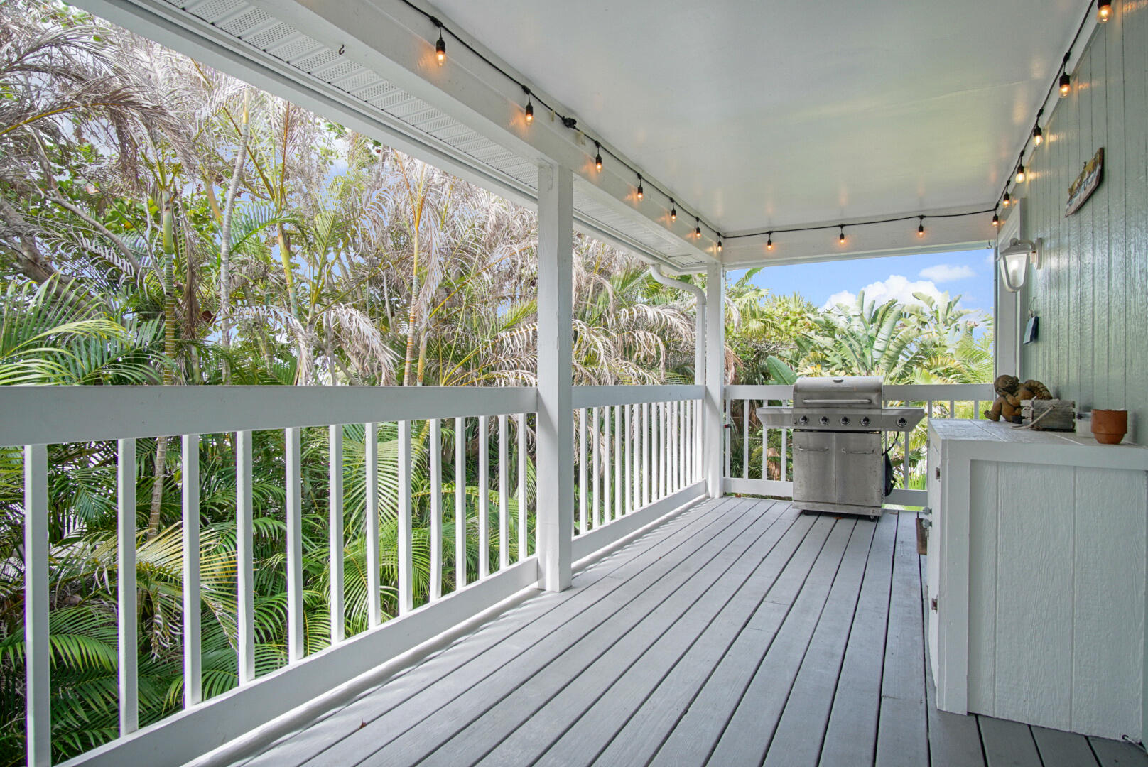413 Hernando Street Fort Pierce, FL 34949 - Photo 6 of 43 a view of a porch with wooden floor