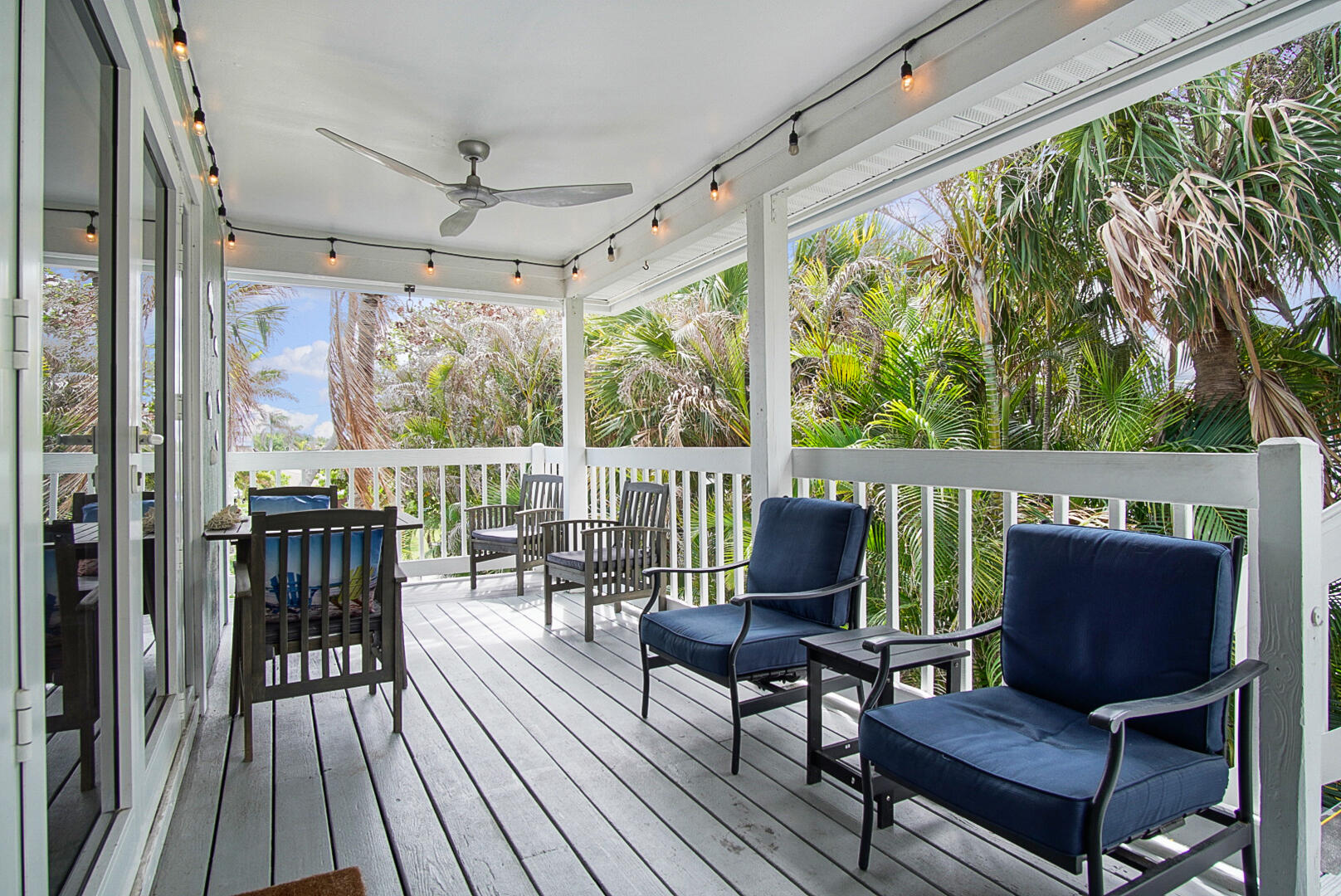 413 Hernando Street Fort Pierce, FL 34949 - Photo 7 of 43 a view of a chairs and table in the balcony