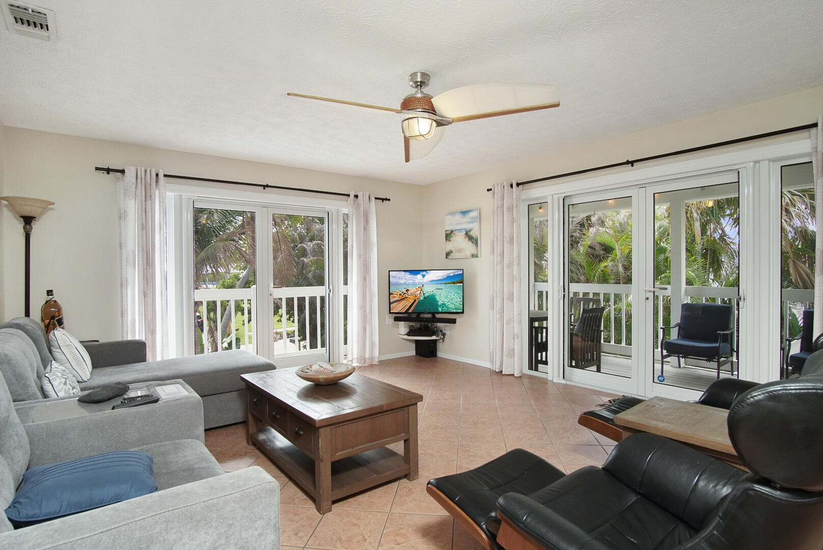 413 Hernando Street Fort Pierce, FL 34949 - Photo 8 of 43 a living room with furniture and large windows