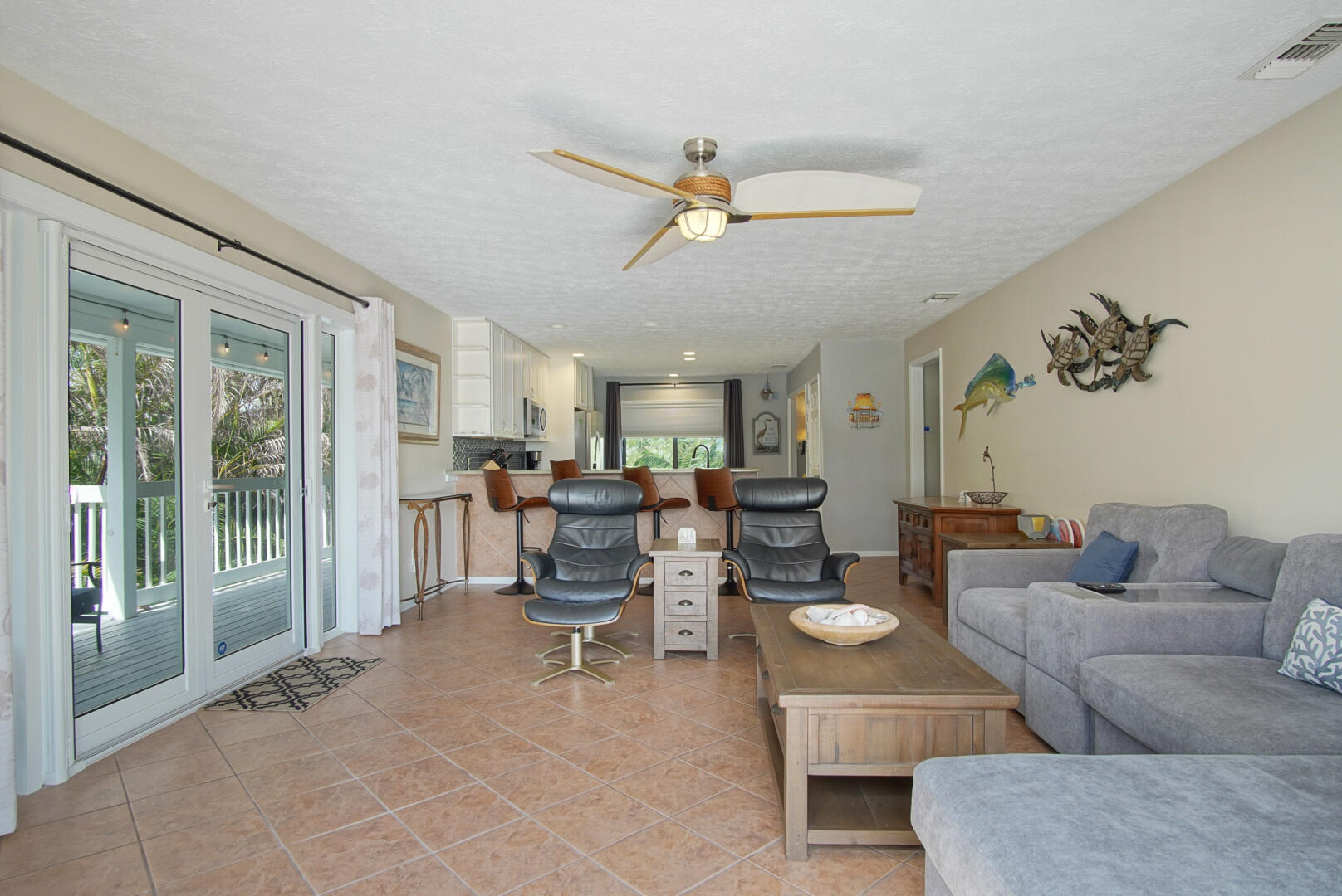 413 Hernando Street Fort Pierce, FL 34949 - Photo 9 of 43 a living room with furniture and a large window