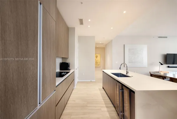 a kitchen with sink a counter top space and appliances