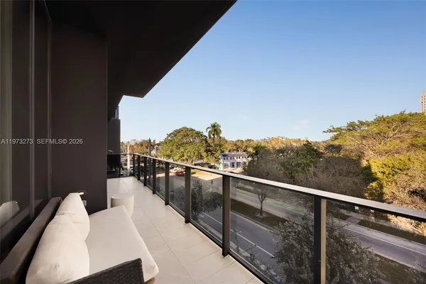 a view of balcony with furniture