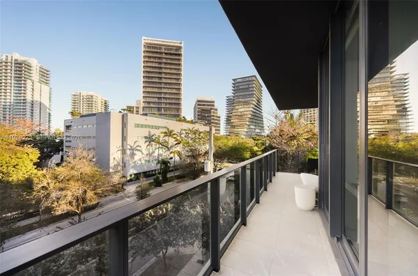 a view of balcony with furniture
