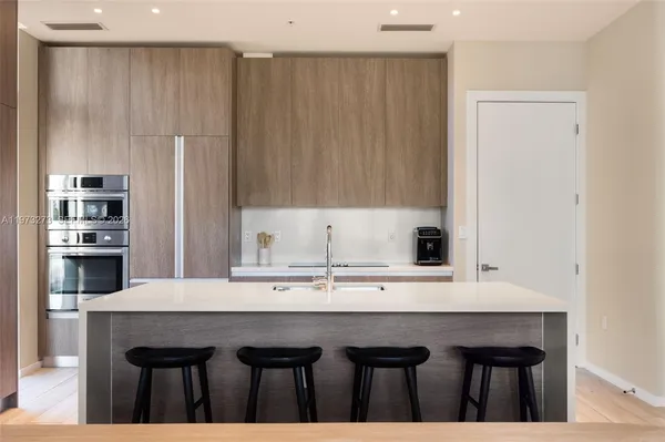 a view of kitchen with furniture and wooden floor